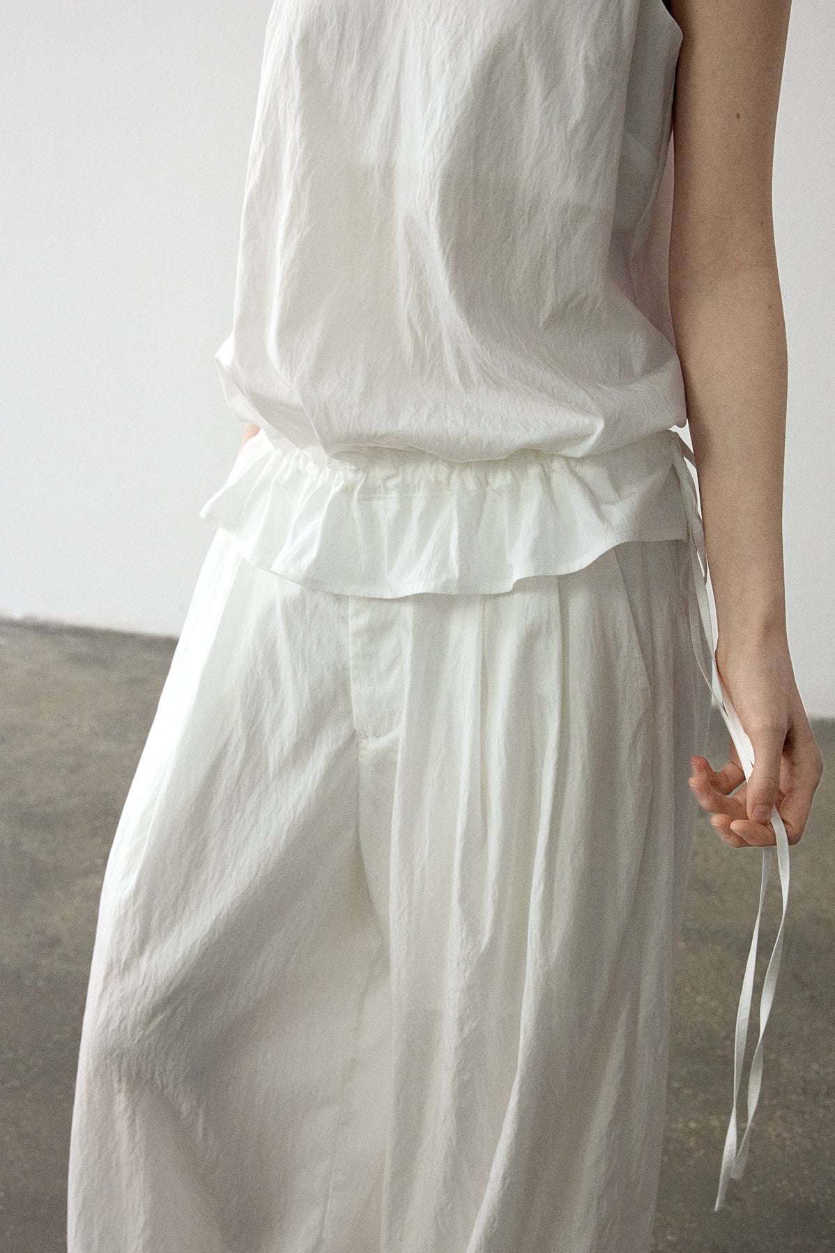 Viscose blend pleated edge sling top