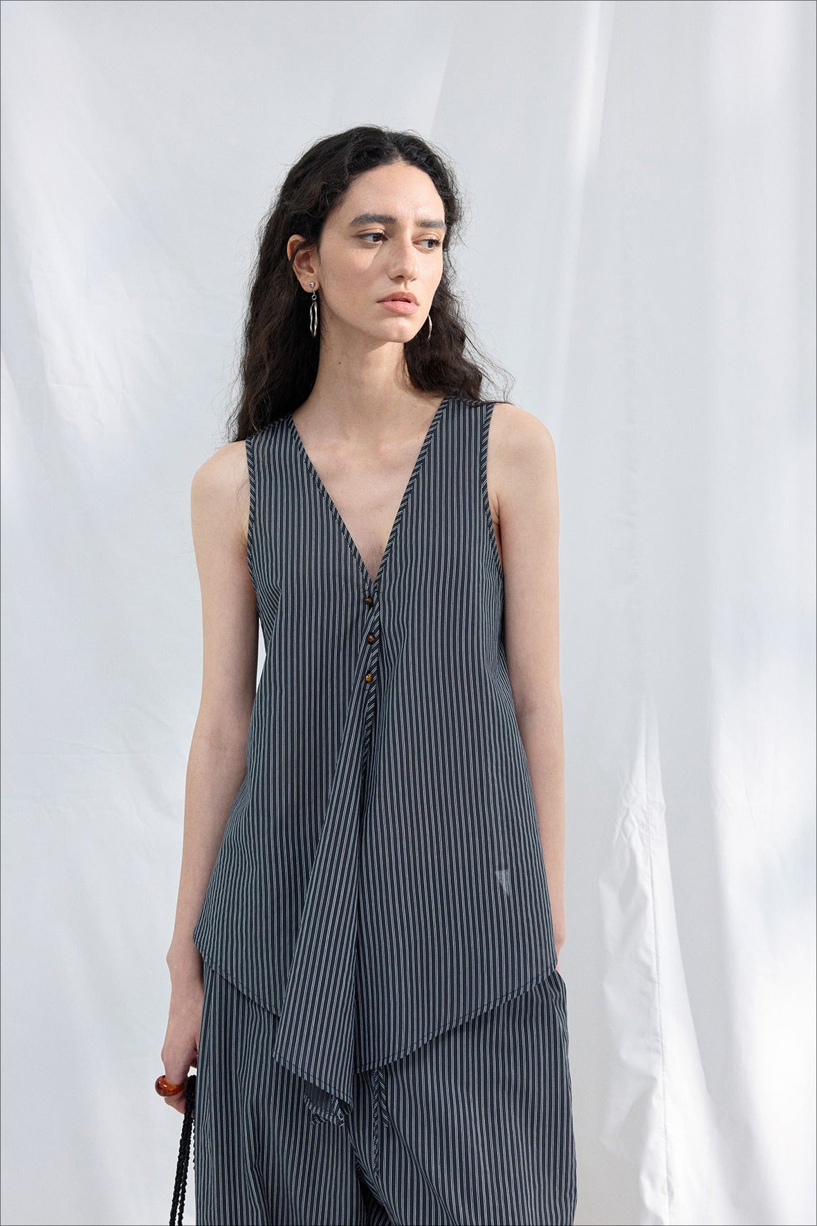 Lyocell blend irregular hemline top | 2 color