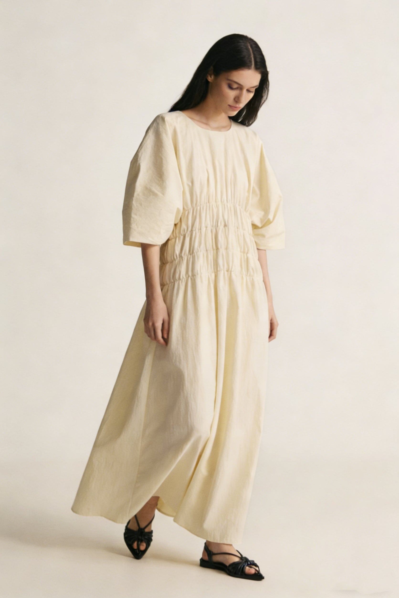Customizable Pleated waist puff-sleeved creme dress